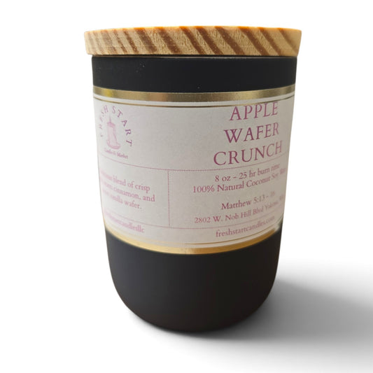 Fresh Start Candles Apple Wafer Crunch scented candle in a matte black jar with a wooden lid.