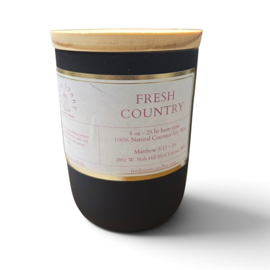 Fresh Start Candles Fresh Country 8oz coconut and soy wax candle in a matte black jar with a wooden lid.