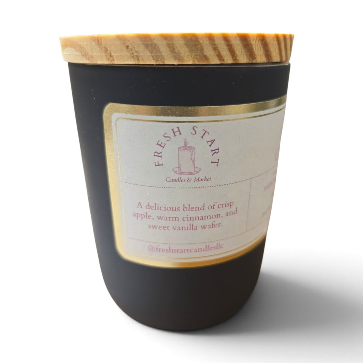 Fresh Start Candles Apple Wafer Crunch scented candle in a matte black jar with a wooden lid.