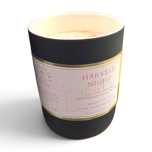 Fresh Start Candles Harvest Night scented candle in a matte black jar with a cream label and natural wax blend